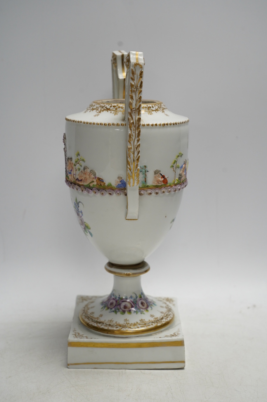 A Capodimonte / Naples style urn, early 19th century 26cm. Condition - poor (base cracked)